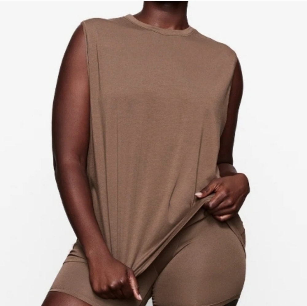 Anthropologie medium dark neutral open back great for layering as well top